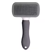 Self cleaning slicker brush